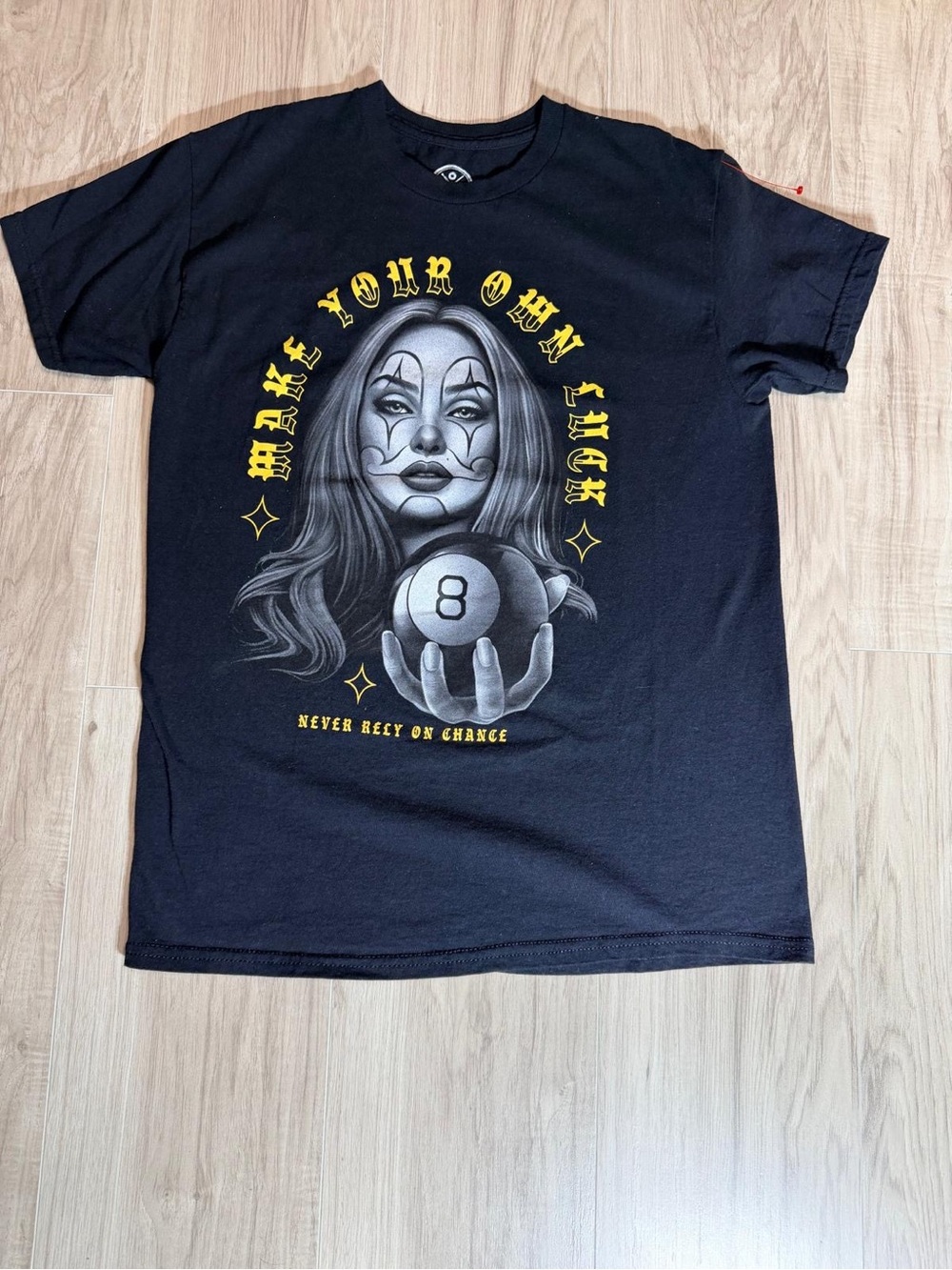 Black Graphic Tee with 8-Ball Portrait and Yellow Accents